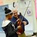 Tappan Middle School orchestra director Joe DeMarsh helps eight grader Monica Mitchenor with her violin during class at Tappan on Thursday, Jan. 17. Members of the Tappan band, choir and orchestra are headed to Washington D.C. in June to perform a concert on the steps of the Lincoln Memorial to commemorate the 50th anniversary of Martin Luther King Jr.'s "I have a dream" speech. Melanie Maxwell I AnnArbor.com